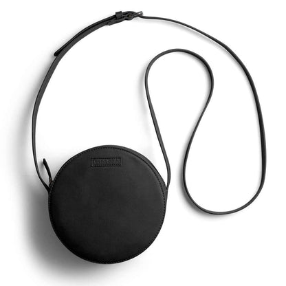 DailyObjects Orbis Round Sling Crossbody Bag For Women| Stylish Solid Black Faux Leather Purse With Slip Pocket & 2 Compartments Inside| Zip Closure & Adjustable Strap| Storage Space For Essentials