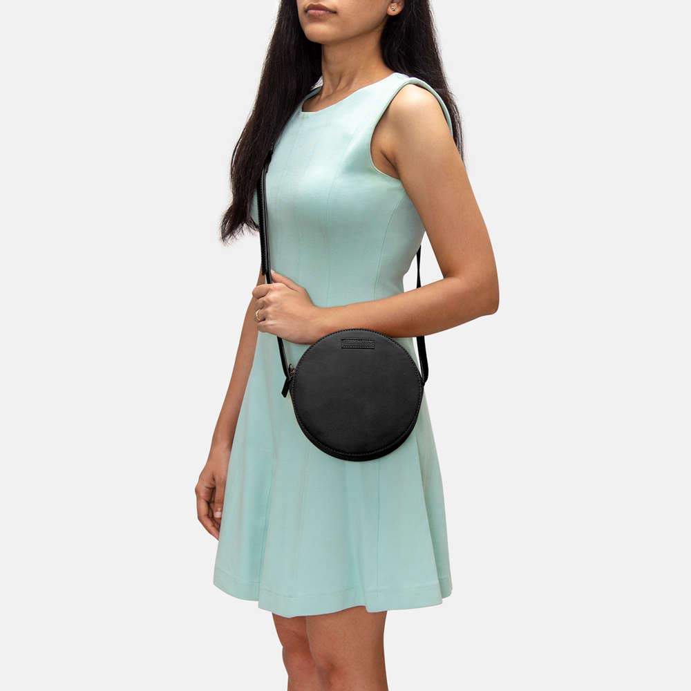 DailyObjects Orbis Round Sling Crossbody Bag For Women| Stylish Solid Black Faux Leather Purse With Slip Pocket & 2 Compartments Inside| Zip Closure & Adjustable Strap| Storage Space For Essentials