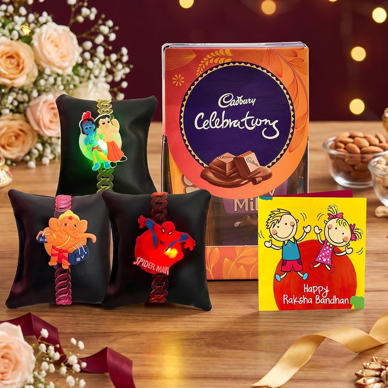 TIED RIBBONS Rakhi for Kids with Chocolates Gift Pack - Set of 3 Premium Kids Lights Rakhi with Cadbury Celebrations Chocolates Gift Pack Roli Chawal Greeting Card, 250 Grams