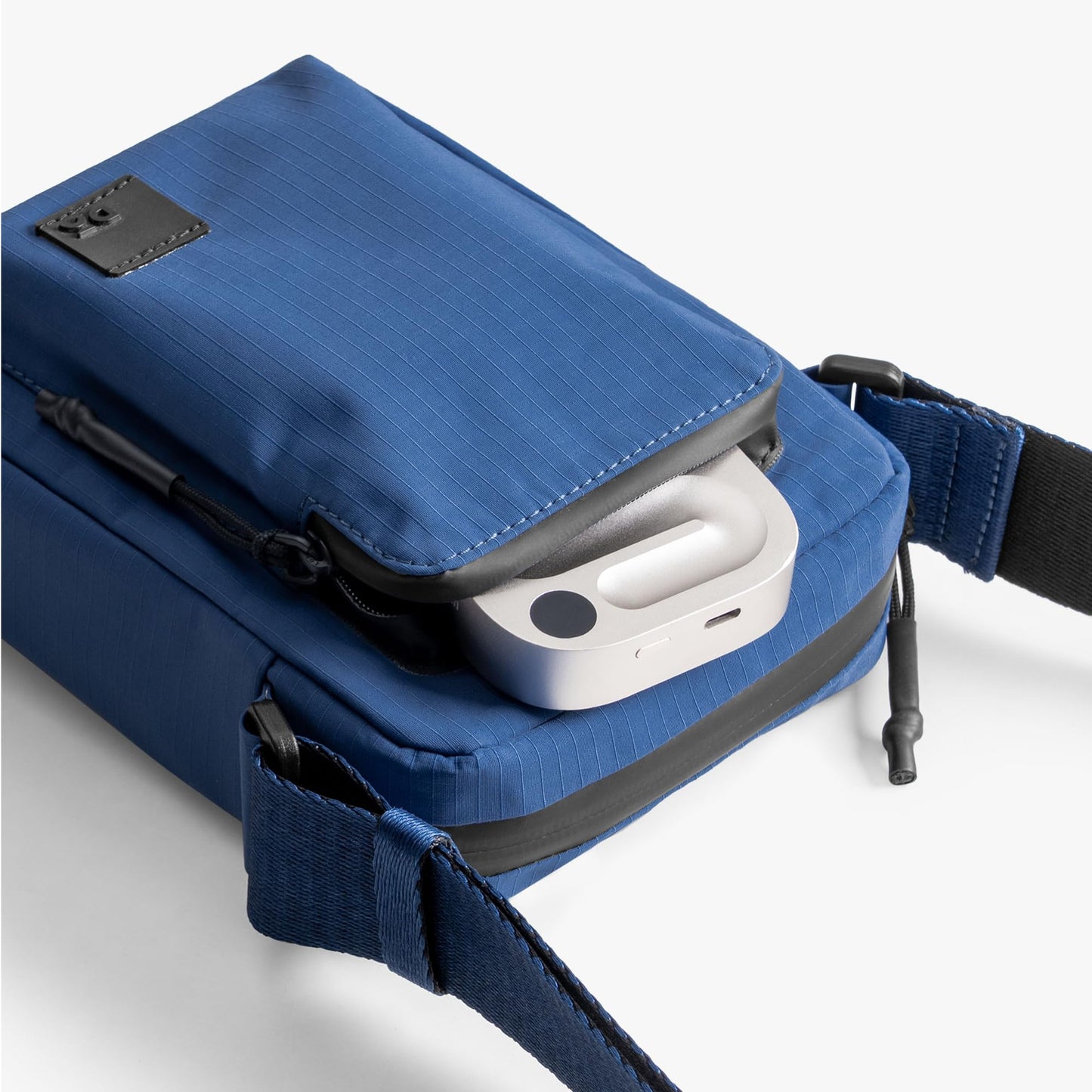 DailyObjects Pivot Travel Sling Bag for Men and Women|Adjustable Shoulder Strap|Recycled Lightweight Material|Water Repellent|Zippered Main Compartment|Slip Pockets| For Daily Use & Travel (Blue)