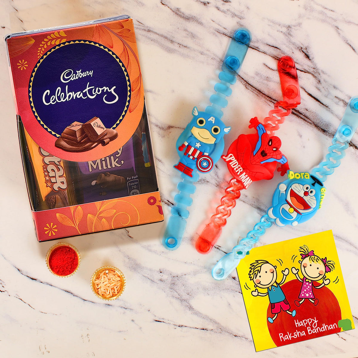 TIED RIBBONS Rakhi for Kids with Chocolates Gift Pack - Set of 3 Premium Kids Lights Rakhi with Cadbury Celebrations Chocolates Gift Pack Roli Chawal Greeting Card, 250 Grams